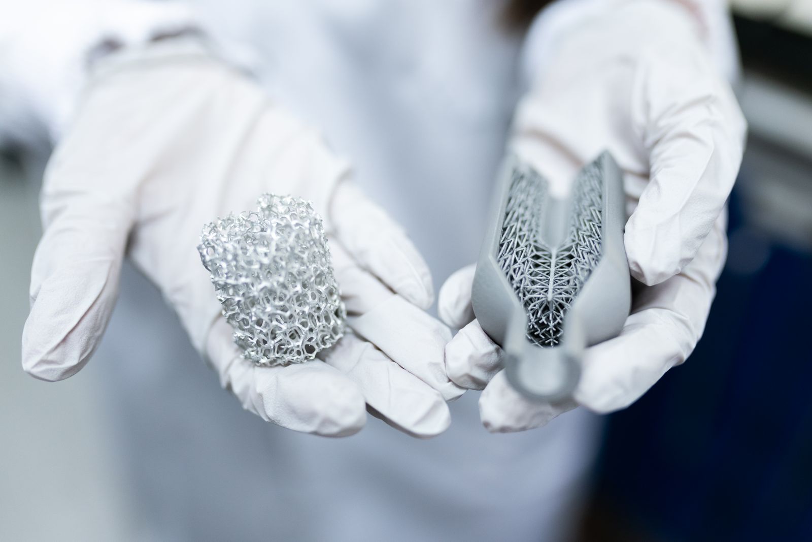 Additively manufactured metal housings with their support structures, still on the build plate