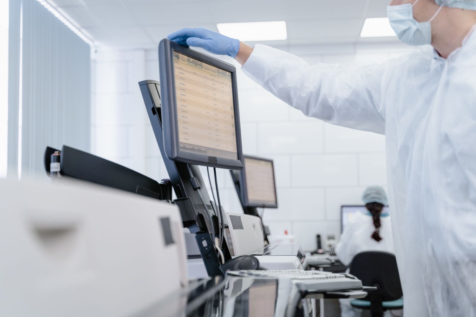 A researcher reviewing analysis on a laboratory display